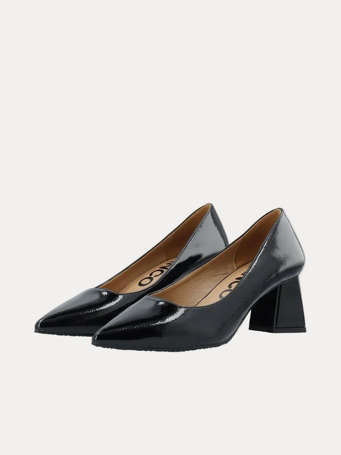 A pair of black patent leather pumps with a block heel and pointed toe, displayed on a clean white background.