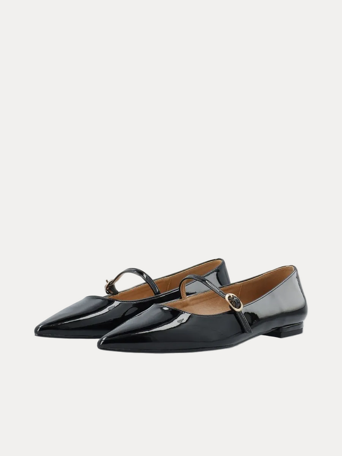 A pair of black patent leather Mary Jane flats with pointed toes and a small gold-tone buckle, shown on a clean white background.