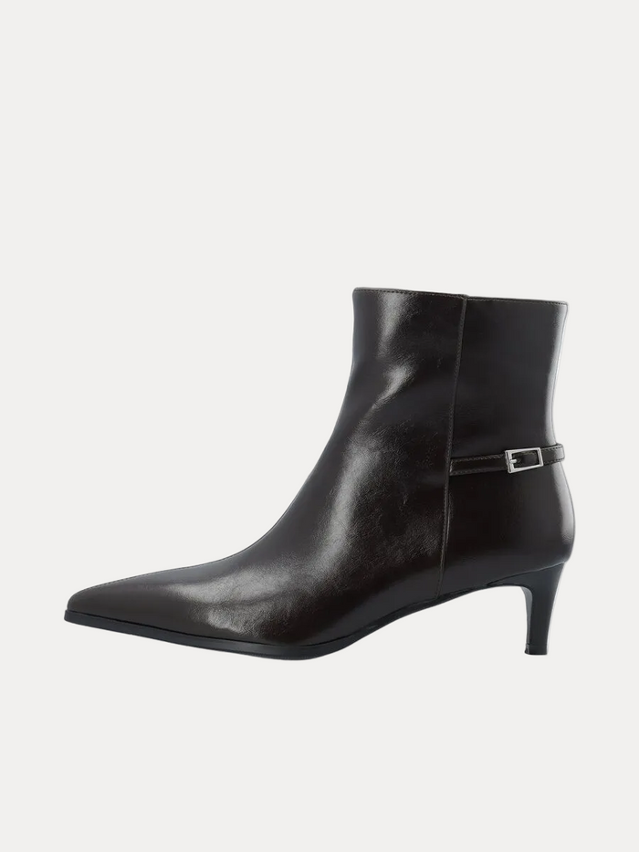 A black leather ankle boot with a pointed toe and a slim side buckle strap, shown from a side profile on a white background.