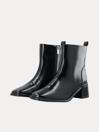 A pair of black leather ankle boots with a side zipper, square toes, and low block heels, shown on a plain white background.