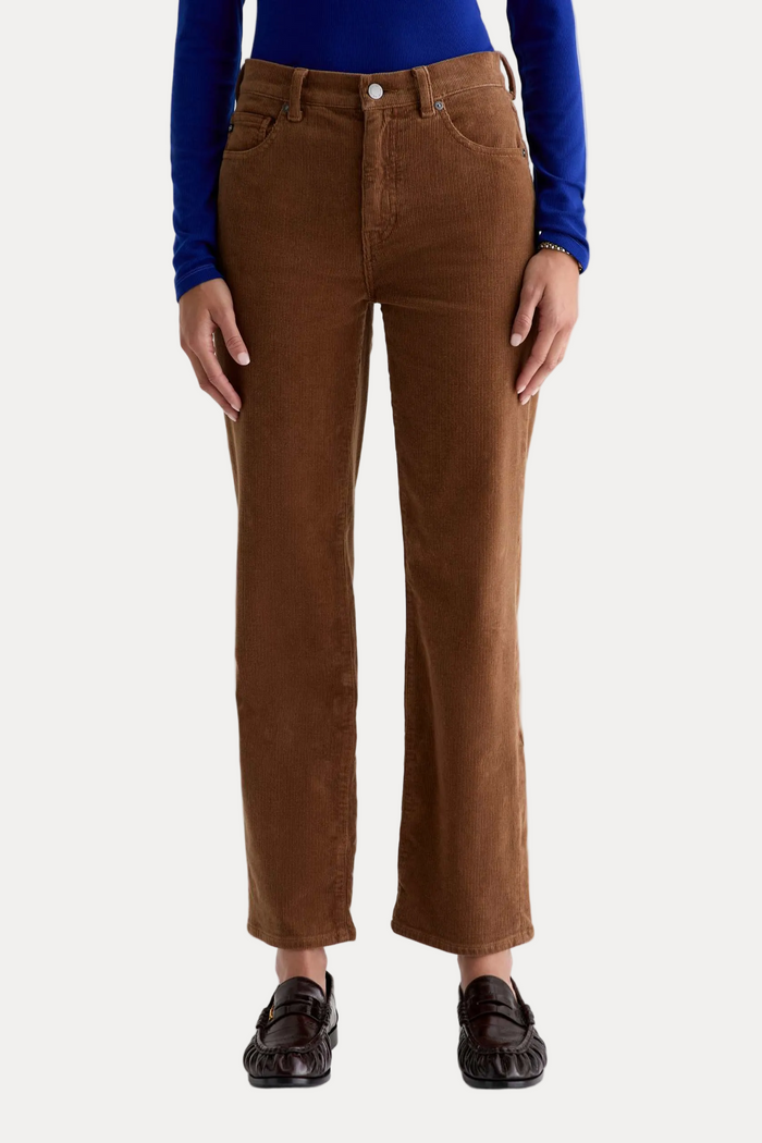 Brown pants worn by a person on a white background