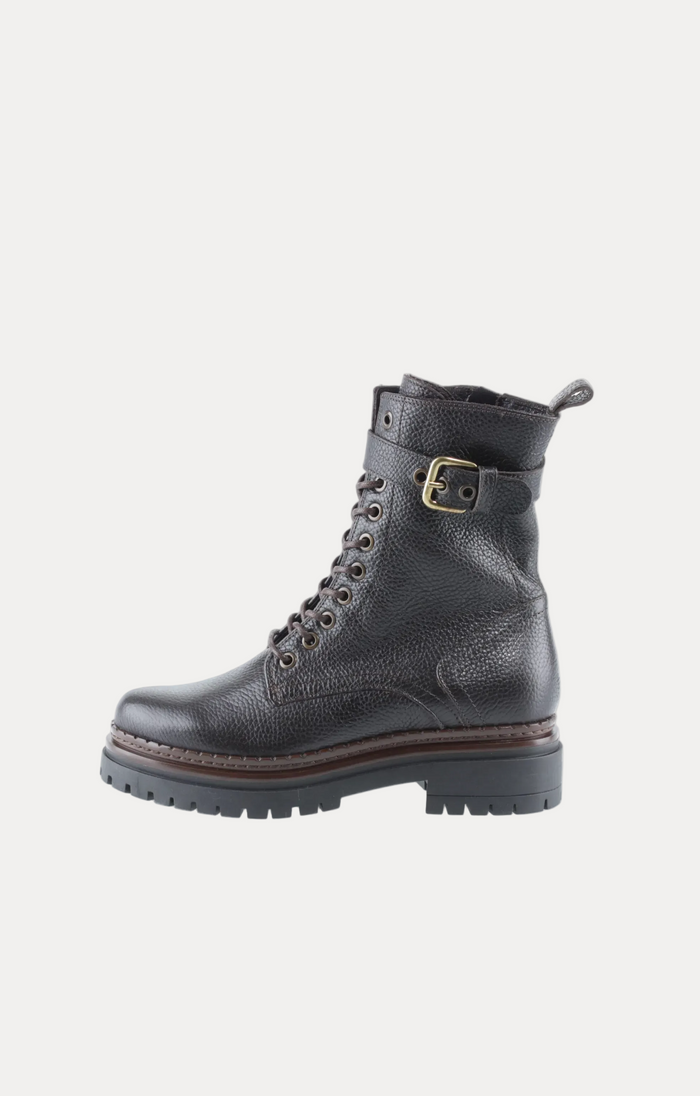 Dark brown leather Chelsea boot on a white background